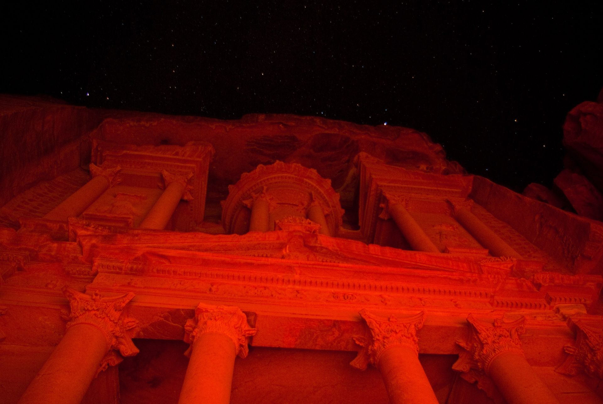 The Treasury facade at night under stars